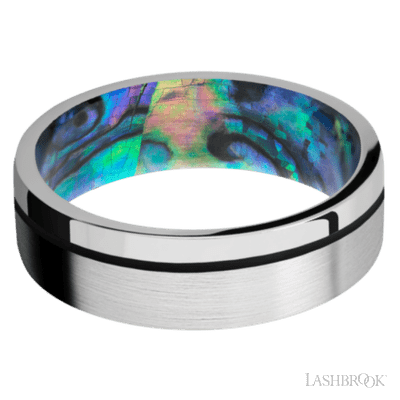 7 mm wide/Flat/14K White Gold band with one 0.5 mm Off Center inlay of Black also featuring a Abalone sleeve.