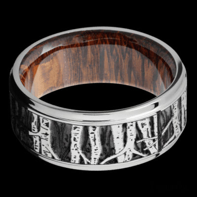9 mm wide/Flat Grooved Edges/Cobalt Chrome band with a laser carved Aspen pattern also featuring a Leopard Wood sleeve.