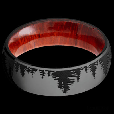 7 mm wide/Domed/Zirconium band with a laser carved Trees pattern also featuring a Padauk sleeve.